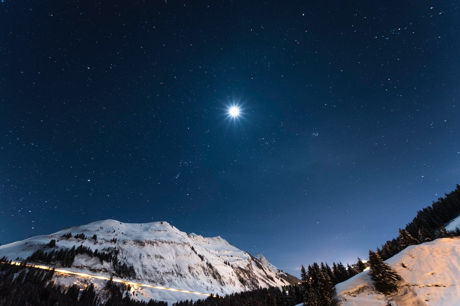 white mountain under starry night